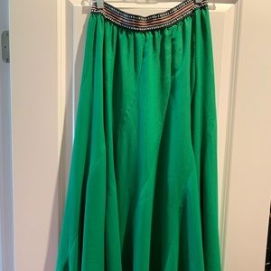 Green Anthropologie maxi skirt asymmetrical hem
